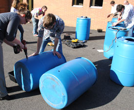 Photo of rain barrels under construction